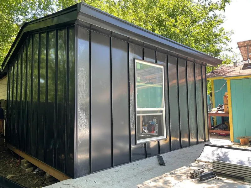Black standing seam metal wall panels for Roof Inspection in Steiner Ranch