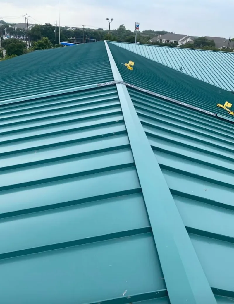 Green commercial metal roof ridge and valley for Metal Roof Repair in Steiner Ranch