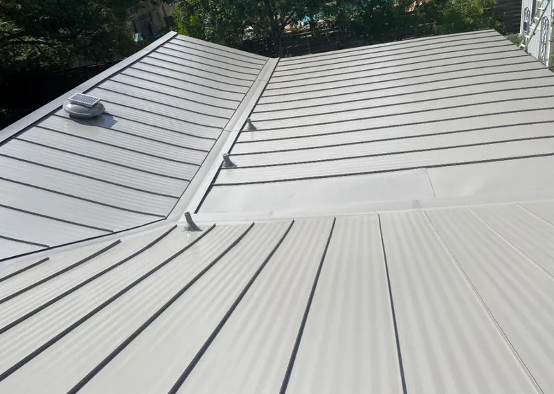 Solar attic fan installed on a metal roof for Roof Ventilation in Steiner Ranch